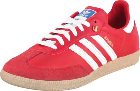 red adidas samba trainers.